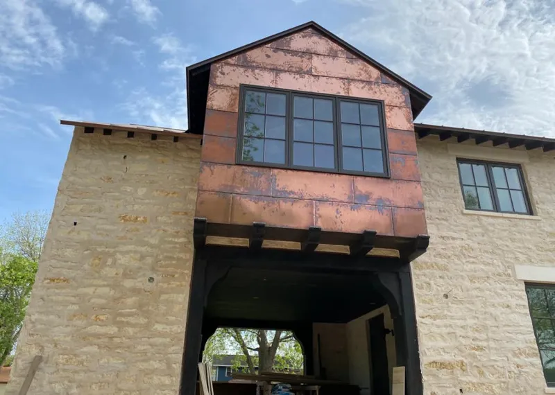 Copper metal panel facade on a stone building for Metal Roof Coating in Lecanto
